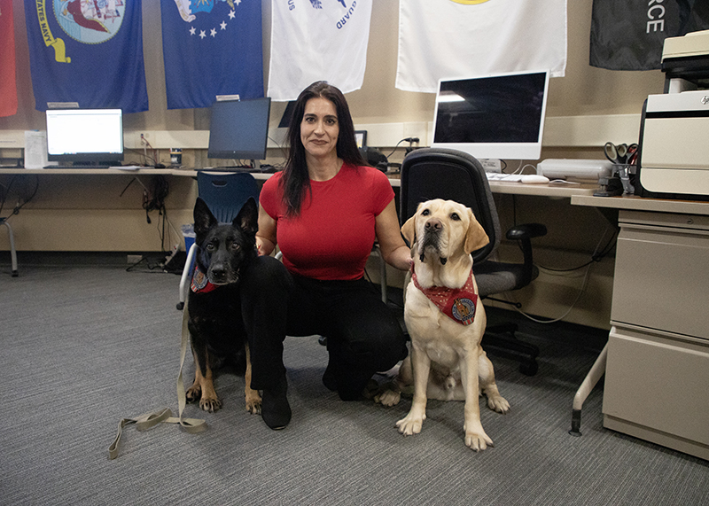Kristin Hughes and her dogs in the Veterans Resource Center at St. Cloud State University