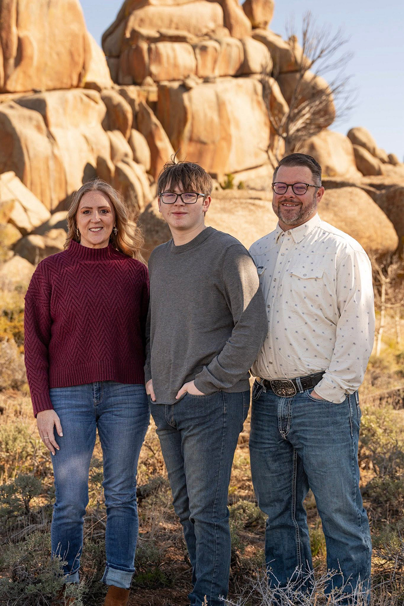 Matt Chapman posing with his wife and son
