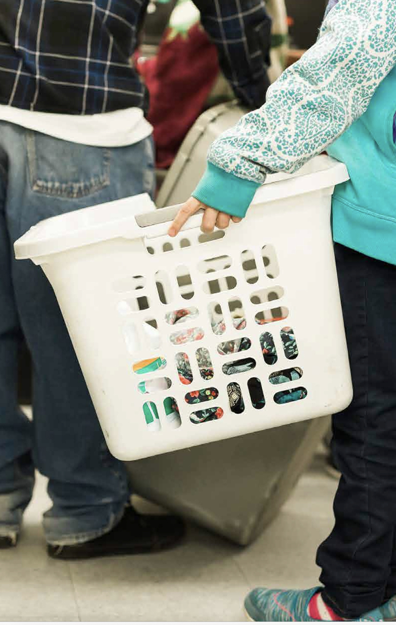 Person holding a laundry basket