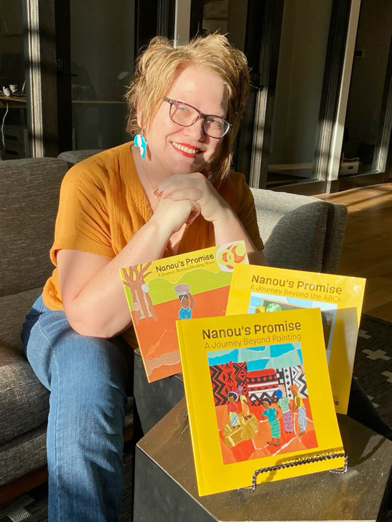 Sarah Drake with children's books that she has written and illustrated